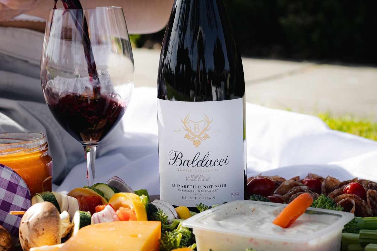 Baldacci Elizabeth Pinot Noir being enjoyed during an outdoor picnic